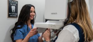 A Dental Associate providing a Sincere Smile scan.