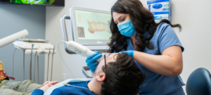 A Sincere Smile Dental Associate performing a digital scan on a patient.