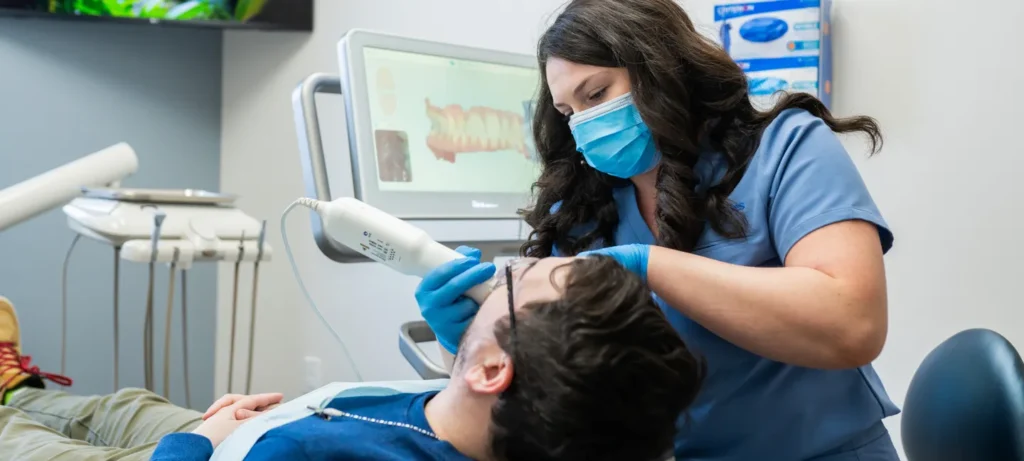 A dental assistant taking an x-ray at Sincere Smiles Dental