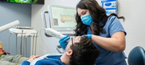 A dental assistant taking an x-ray at Sincere Smiles Dental